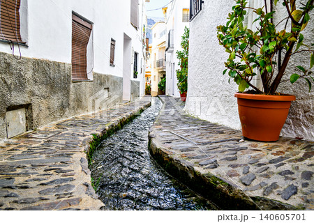 Pampaneira, in the Alpujarra region of Granada, with its narrow, steep streets and water channels running through them 140605701