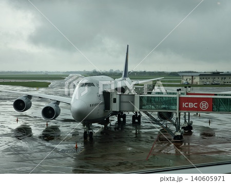 Buenos Aires, Argentina - April 21, 2026: Passenger aircraft on wet apron at Ezeiza International Airport Buenos Aires, Argentina - April 21, 2026: Passenger aircraft on wet apron at Ezeiza International Airport 140605971