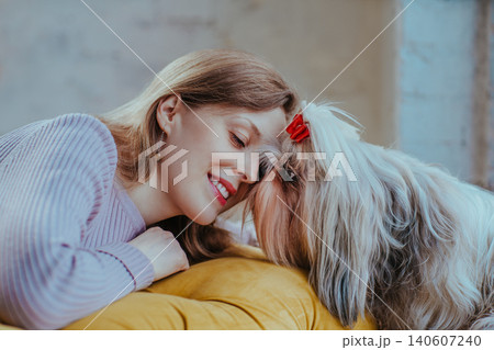 Portrait of a young woman with her beloved shih tzu dog 140607240