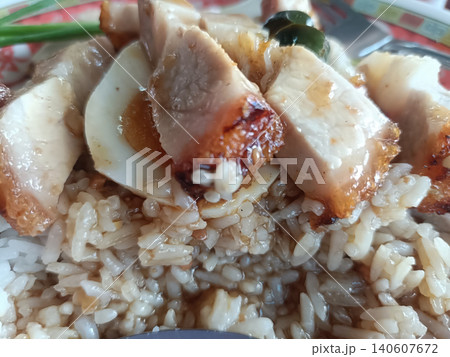 Rice pork roast egg sauce, sliced roasted pork over rice with egg and savory sauce Rice pork roast egg sauce, sliced roasted pork over rice with egg and savory sauce 140607672