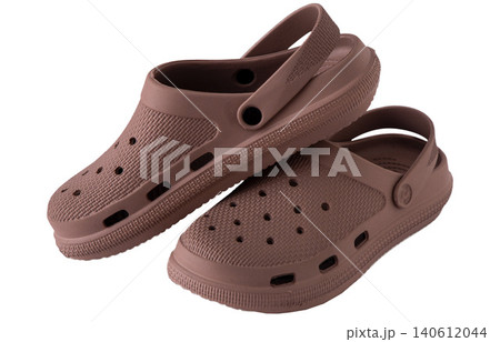 Pair brown rubber clogs isolated on white background. Pair brown rubber clogs isolated on white background. 140612044