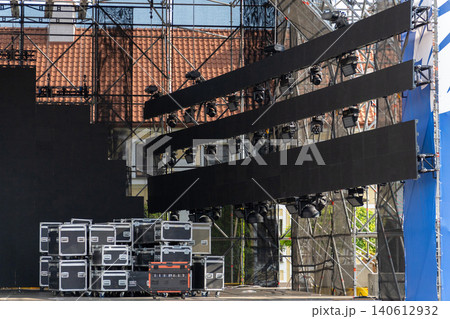 Outdoor concert stage setup with large LED video screens 140612932