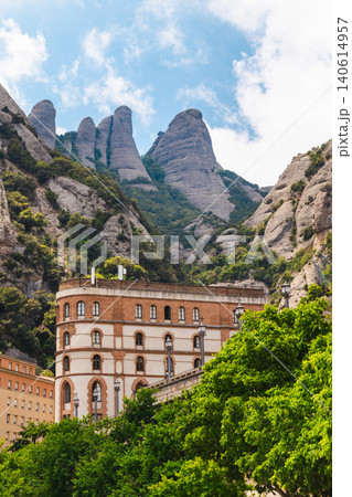 Montserrat monastery building beneath iconic rock formations in Catalonia Spain 140614957