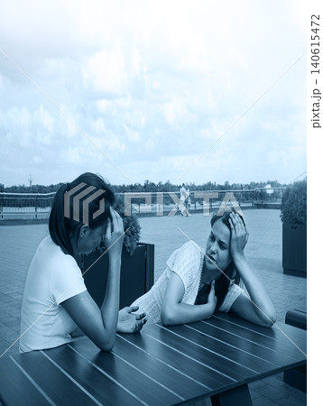 Young girls in a cafe Young girls in a cafe 140615472