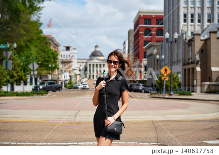 Woman in Black Dress Strolling on Capitol Street in Jackson Mississippi 140617758