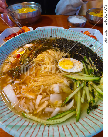 Noodles in Young Summer Radish Kimchi Broth. yeolmu kimchi guksu Noodles in Young Summer Radish Kimchi Broth. yeolmu kimchi guksu 140617975