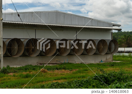 Industrial Ventilation Fans on Modern Poultry Farm Building Exterior Industrial Ventilation Fans on Modern Poultry Farm Building Exterior 140618063