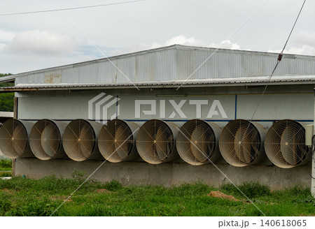 Industrial Ventilation Fans on Modern Poultry Farm Building Exterior Industrial Ventilation Fans on Modern Poultry Farm Building Exterior 140618065