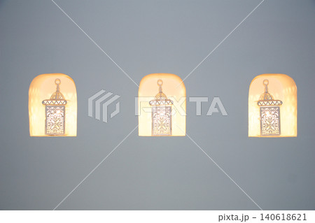 Fujairah, United Arab Emirates, November 04 2017: Three oriental wall lamps in decorative niches in luxury hotel Fujairah, United Arab Emirates, November 04 2017: Three oriental wall lamps in decorative niches in luxury hotel 140618621