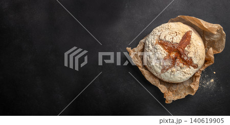Artisan sourdough bread on dark background with copy space, rustic homemade bakery concept 140619905