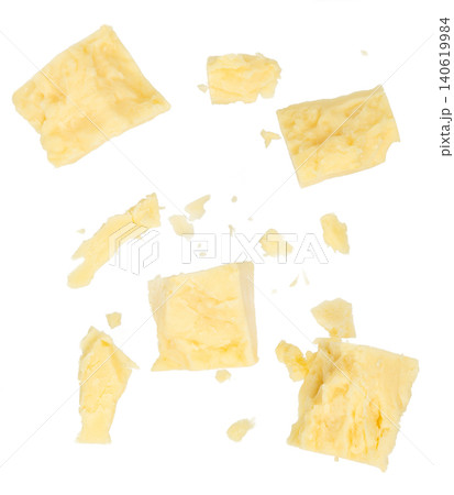 Crumbled parmesan cheese pieces isolated on white background, top view flat lay food texture Crumbled parmesan cheese pieces isolated on white background, top view flat lay food texture 140619984