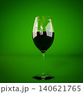 glass of wine isolated on green background 140621765