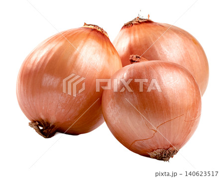Three fresh whole brown onions with golden papery skin isolated. High quality studio shot of raw organic yellow onions used for cooking and healthy food recipes. Three fresh whole brown onions with golden papery skin isolated. High quality studio shot of raw organic yellow onions used for cooking and healthy food recipes. 140623517