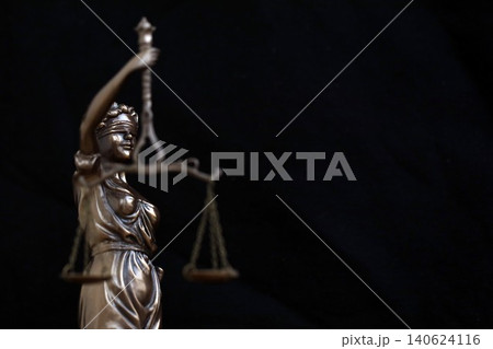 Lady Justice female statue in law on black backdrop. Law and justice Lady Justice female statue in law on black backdrop. Law and justice 140624116