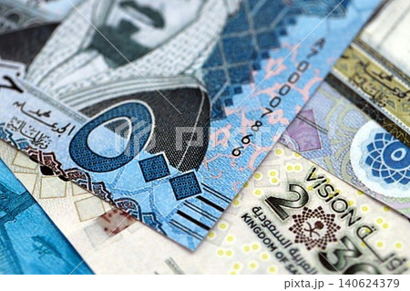 Saudi Arabia riyal money bills banknotes lies in big pile on table. Business in Saudi Arabia Saudi Arabia riyal money bills banknotes lies in big pile on table. Business in Saudi Arabia 140624379