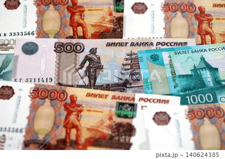 Russian ruble money bills banknotes lies in big pile on table. Concept of finances and business 140624385