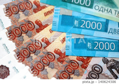 Russian ruble money bills banknotes lies in big pile on table. Concept of finances and business 140624386