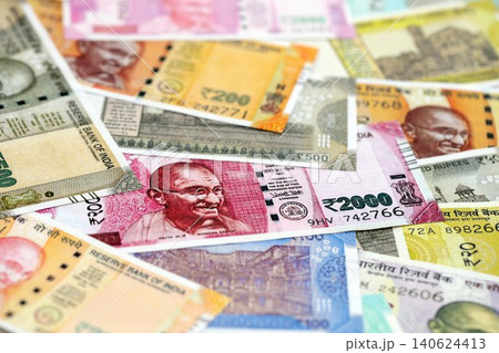 Big pile of Indian Rupees money bills banknotes close up. Lots of money of Indian INR currency cash Big pile of Indian Rupees money bills banknotes close up. Lots of money of Indian INR currency cash 140624413