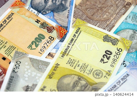Big pile of Indian Rupees money bills banknotes close up. Lots of money of Indian INR currency cash Big pile of Indian Rupees money bills banknotes close up. Lots of money of Indian INR currency cash 140624414