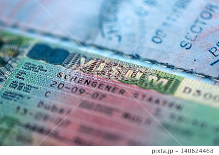 International visa in passport close up view. Schengen visa in passport International visa in passport close up view. Schengen visa in passport 140624468