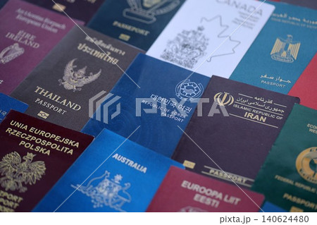 Big amount of passports of various different countries. Covers of expired passports close up 140624480