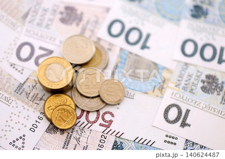 Big amount of polish zloty money banknotes and grosz coins close up. Huge pile of cash of Poland 140624487