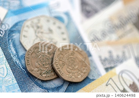 Coins and banknotes of United Kingdom and Great Britain pound currency. UK money close up Coins and banknotes of United Kingdom and Great Britain pound currency. UK money close up 140624498
