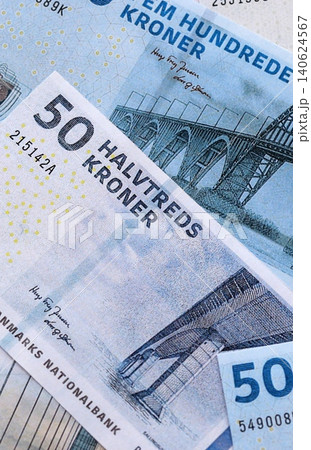 Danish krone paper banknotes pile on table. Denmark DKK currency money bills in big amount 140624567