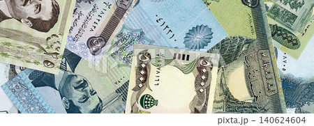 Iraqi dinar paper banknotes pile on table. Iraq IQD currency money bills in big amount 140624604