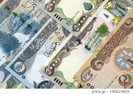 Iraqi dinar paper banknotes pile on table. Iraq IQD currency money bills in big amount 140624605