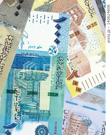 Sudanese pound paper banknotes pile on table. Sudan SDG currency money bills in big amount Sudanese pound paper banknotes pile on table. Sudan SDG currency money bills in big amount 140624606