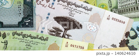 Yemeni rial paper banknotes pile on table. Yemen YER currency money bills in big amount 140624610
