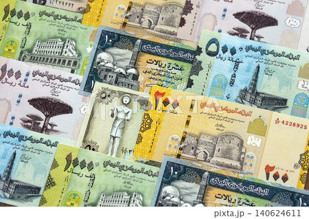 Yemeni rial paper banknotes pile on table. Yemen YER currency money bills in big amount 140624611