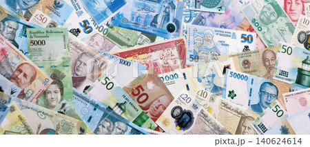 Different colorful banknotes from many various currencies of the world. Currency Exchange concept 140624614