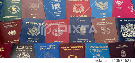 Big amount of passports of various different countries. Covers of expired passports close up Big amount of passports of various different countries. Covers of expired passports close up 140624623