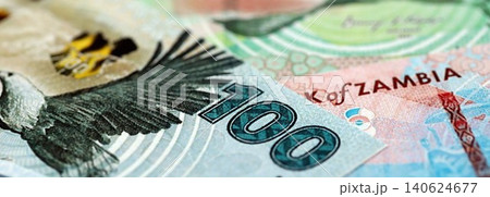 Zambian kwacha money bills pile on table. Zambia banknotes of ZMW currency close up Zambian kwacha money bills pile on table. Zambia banknotes of ZMW currency close up 140624677