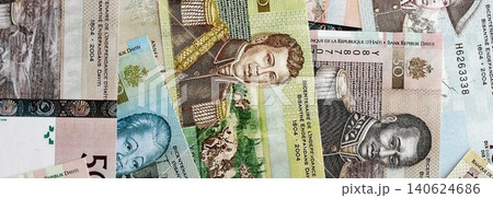 Haitian gourde money bills pile on table. Haiti banknotes of HTG currency. Concept of business Haitian gourde money bills pile on table. Haiti banknotes of HTG currency. Concept of business 140624686