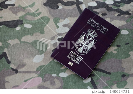 Serbian passport on table close up. Official identification document book for citizens of Serbia Serbian passport on table close up. Official identification document book for citizens of Serbia 140624721