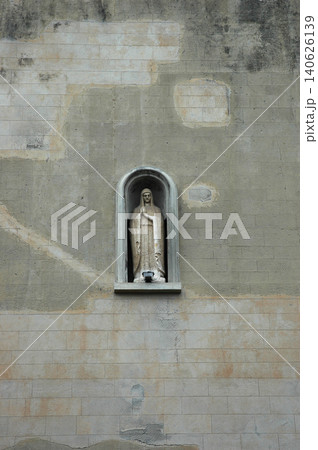 Statue of Virgin Mary in a stone wall niche at the Shrine of Christ the King in Messina 140626139