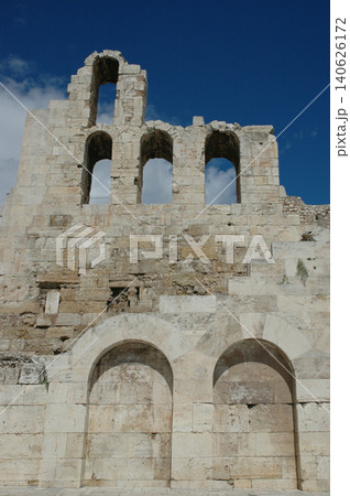 Ruined stone facade of Odeon of Herodes Atticus in Athens Greece 140626172