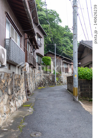 Japanese residential alley with wet pavement after rain Japanese residential alley with wet pavement after rain 140626239