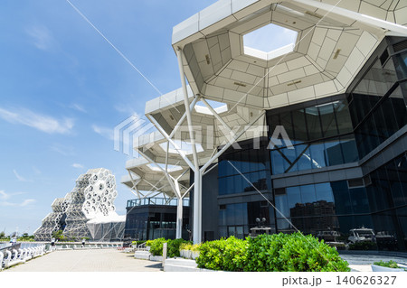 Close-up of Kaohsiung Music Center and the Coral Zone building in Port of Kaohsiung, Taiwan. The white hexagonal building structure on the shore of Love Pier. Close-up of Kaohsiung Music Center and the Coral Zone building in Port of Kaohsiung, Taiwan. The white hexagonal building structure on the shore of Love Pier. 140626327