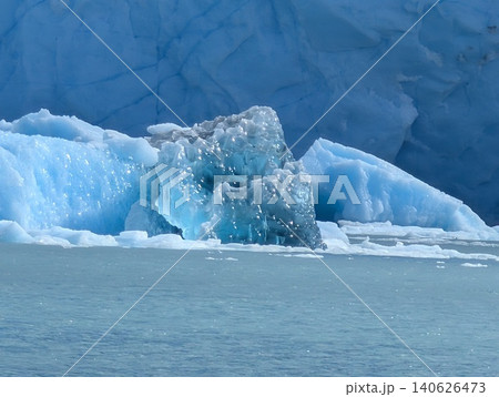 Blue iceberg fragment floating beside Perito Moreno Glacier Blue iceberg fragment floating beside Perito Moreno Glacier 140626473