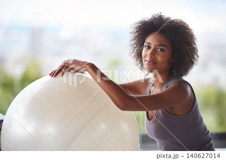 Woman, portrait and exercise ball for fitness and wellness in studio with smile for health and break. Face of a happy and young African person with workout, pilates and balance for strength practice Woman, portrait and exercise ball for fitness and wellness in studio with smile for health and break. Face of a happy and young African person with workout, pilates and balance for strength practice 140627014