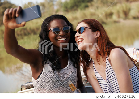 Women, selfie or vacation on road trip in countryside, memory or travel adventure for social media in nature. Ladies, cellphone or profile picture in suv on holiday, care or bonding together by farm Women, selfie or vacation on road trip in countryside, memory or travel adventure for social media in nature. Ladies, cellphone or profile picture in suv on holiday, care or bonding together by farm 140627116
