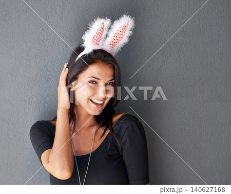 Bunny ears, space or portrait of happy woman with fashion or style isolated on grey background. Model laughing, confident or casual female person in studio with smile, easter holiday or mock up Bunny ears, space or portrait of happy woman with fashion or style isolated on grey background. Model laughing, confident or casual female person in studio with smile, easter holiday or mock up 140627168