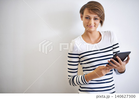 Girl, studio or portrait with tablet, typing and face for social media or communication. Woman, tech and smile with technology, online connection or internet message isolated on white background Girl, studio or portrait with tablet, typing and face for social media or communication. Woman, tech and smile with technology, online connection or internet message isolated on white background 140627300
