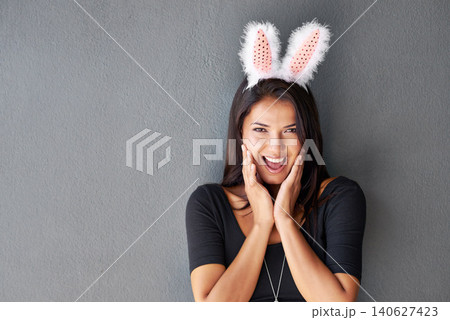 Bunny ears, space or portrait of woman on easter holiday isolated on wall or grey background with style. Happy model, confident lady or excited person in studio with smile, joy or announcement mockup 140627423