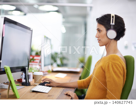 Woman, headphones and computer for creative business, online and listening to music and check email. Female person, journalist and research on article in coworking space, office and website for radio Woman, headphones and computer for creative business, online and listening to music and check email. Female person, journalist and research on article in coworking space, office and website for radio 140627745