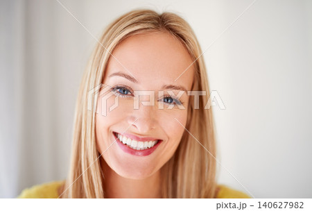 Happy, portrait and woman in a house with positive attitude, confidence and feel good mood on wall background. Face, smile and female person cheerful on vacation, holiday or day off in a living room Happy, portrait and woman in a house with positive attitude, confidence and feel good mood on wall background. Face, smile and female person cheerful on vacation, holiday or day off in a living room 140627982